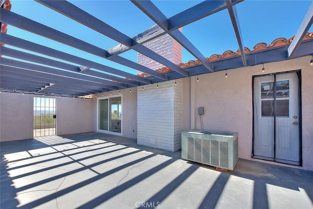 view of patio / terrace featuring central AC and a pergola