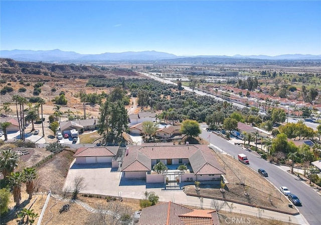 birds eye view of property with a mountain view