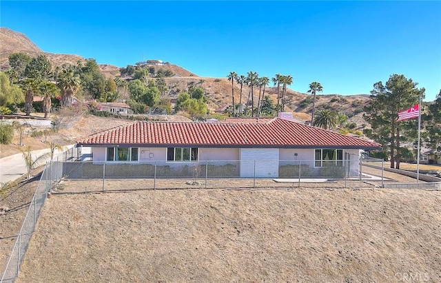 back of house with a mountain view