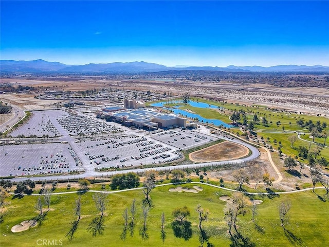 drone / aerial view featuring a water and mountain view