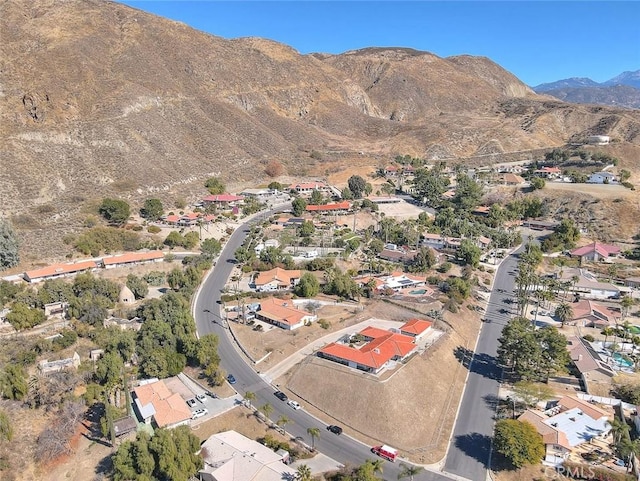 birds eye view of property with a mountain view