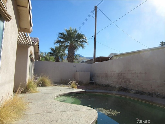 view of pool with a patio area, a fenced in pool, and a fenced backyard