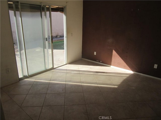 empty room with tile patterned floors