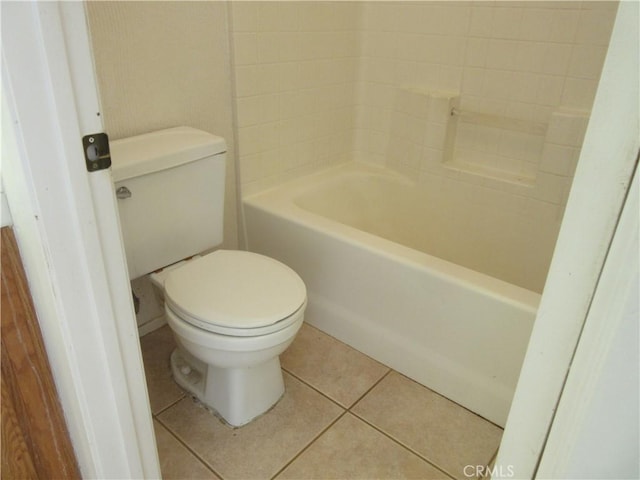 full bath featuring tile patterned floors, a tub, toilet, and walk in shower