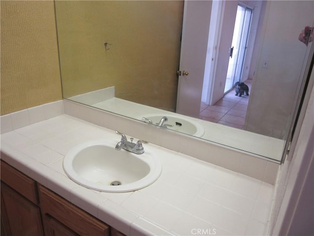 bathroom with tile patterned floors and vanity