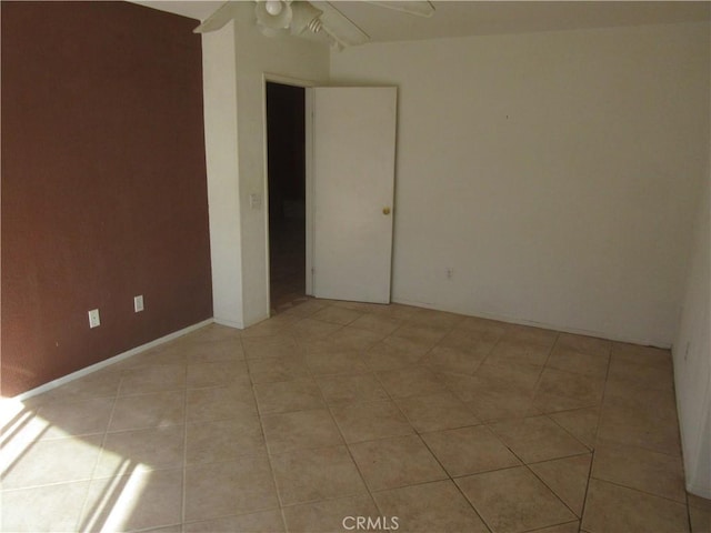 spare room with light tile patterned floors