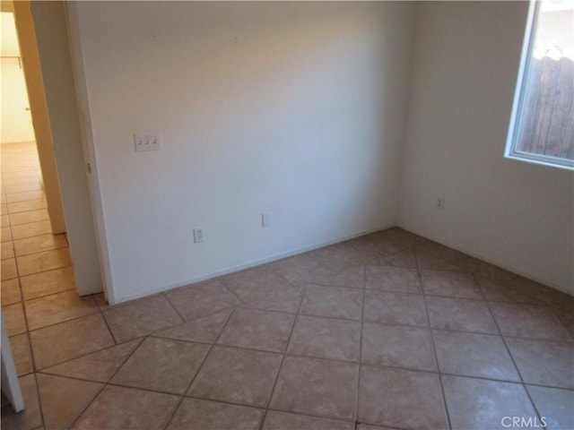 empty room featuring light tile patterned floors