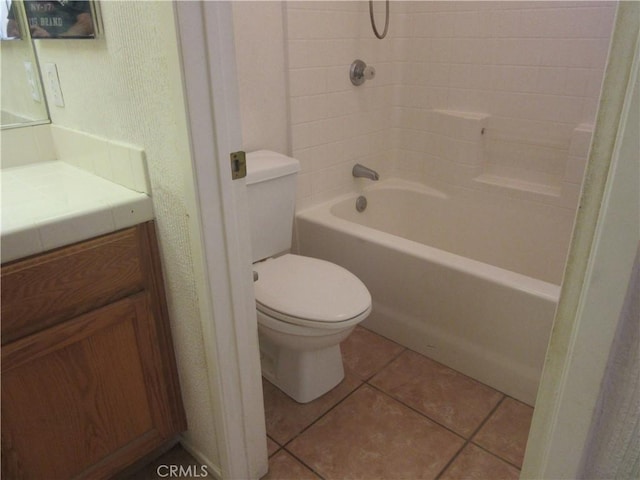 bathroom with tile patterned flooring, shower / tub combination, toilet, and vanity