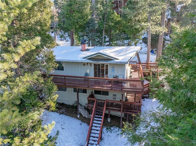 rear view of property featuring a deck