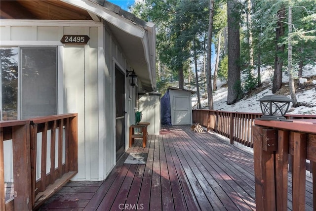 wooden terrace featuring a storage unit