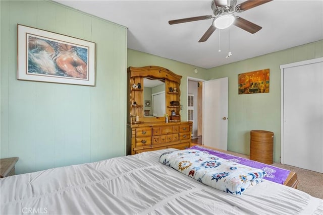 bedroom featuring ceiling fan and carpet flooring