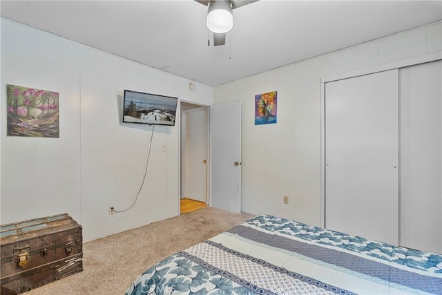 bedroom featuring ceiling fan, carpet flooring, and a closet