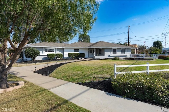 ranch-style house featuring a front yard