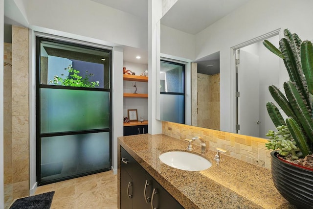 bathroom with tasteful backsplash and vanity