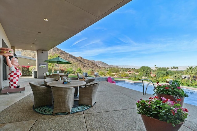 view of patio / terrace with a mountain view