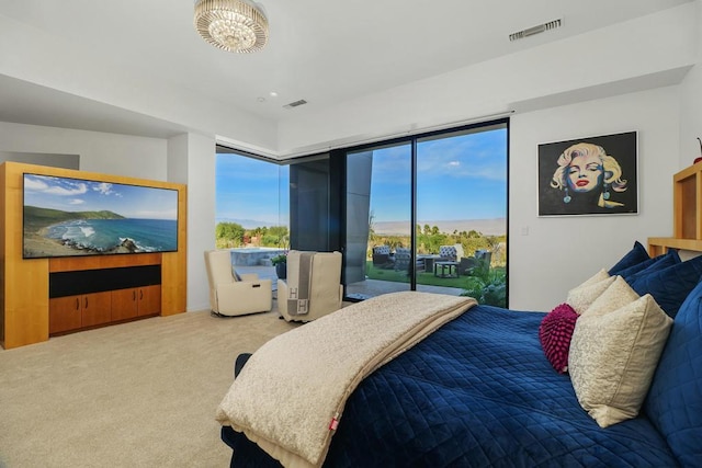 carpeted bedroom featuring access to outside