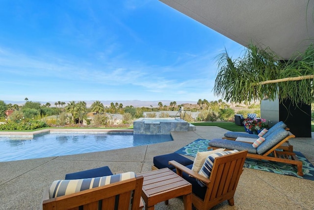 view of pool with a patio and an in ground hot tub