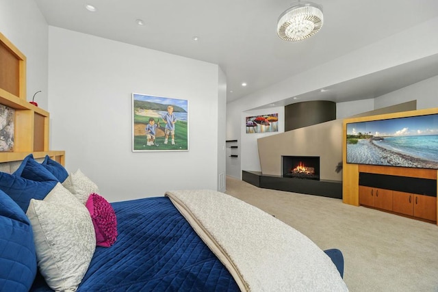 carpeted bedroom with a chandelier