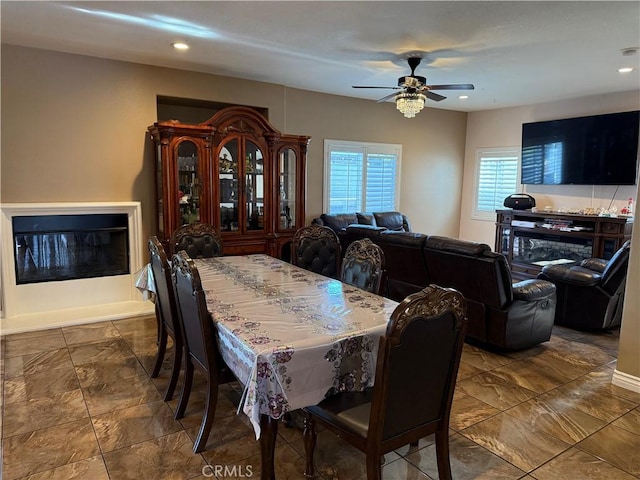 dining space featuring ceiling fan