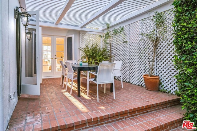 view of patio featuring a pergola and french doors