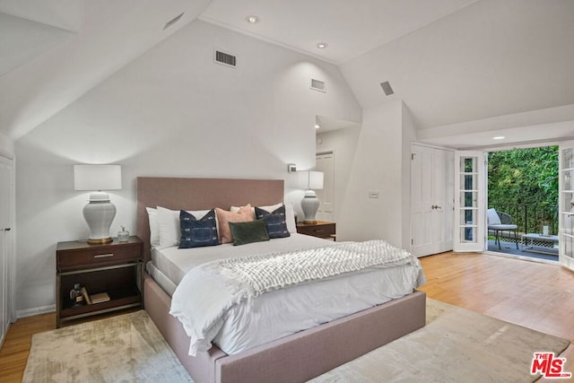 bedroom featuring access to outside, high vaulted ceiling, and light wood-type flooring