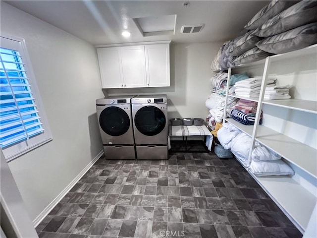 laundry area with cabinets and washer and dryer