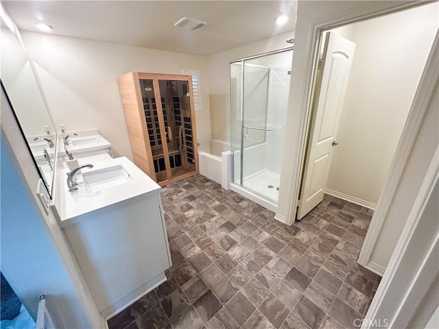 bathroom featuring vanity and shower with separate bathtub