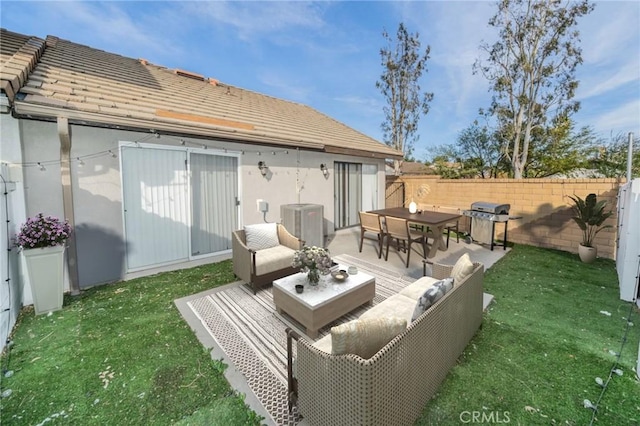 rear view of property featuring a lawn, outdoor lounge area, and a patio