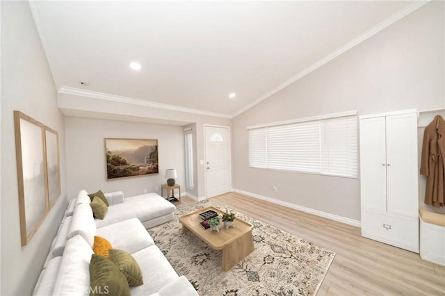 living room with vaulted ceiling, ornamental molding, and light hardwood / wood-style floors