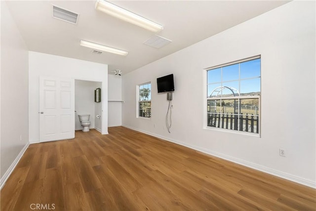 spare room featuring hardwood / wood-style floors