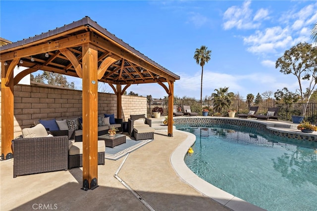 view of pool featuring a fenced backyard, an outdoor living space, a gazebo, a fenced in pool, and a patio area