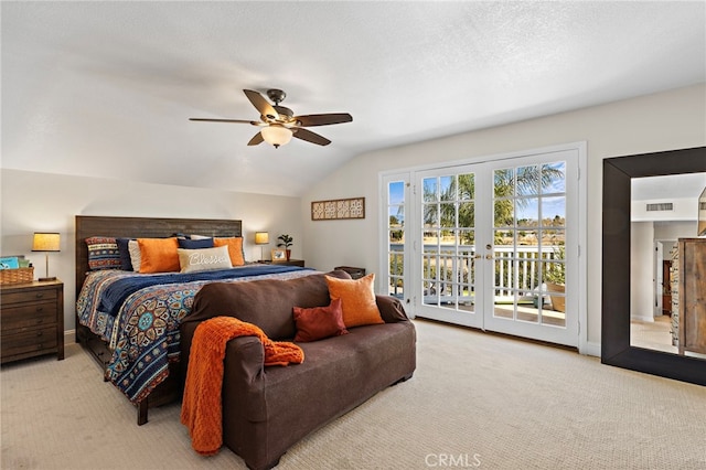 bedroom featuring access to exterior, visible vents, vaulted ceiling, and light colored carpet