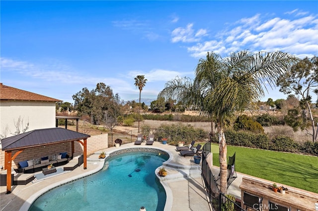 view of swimming pool with a gazebo, a yard, a patio, and a fenced in pool