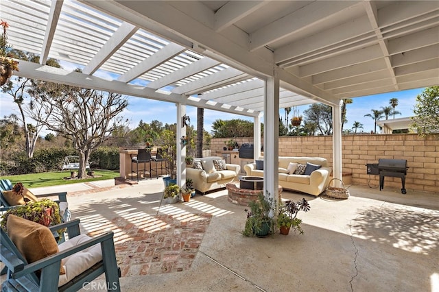 view of patio / terrace with outdoor dry bar, an outdoor hangout area, fence, and a pergola