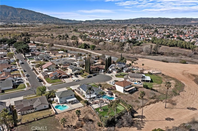 drone / aerial view featuring a residential view and a mountain view