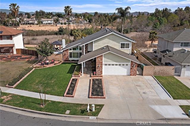 view of front of property with brick siding, concrete driveway, a front yard, a garage, and a residential view