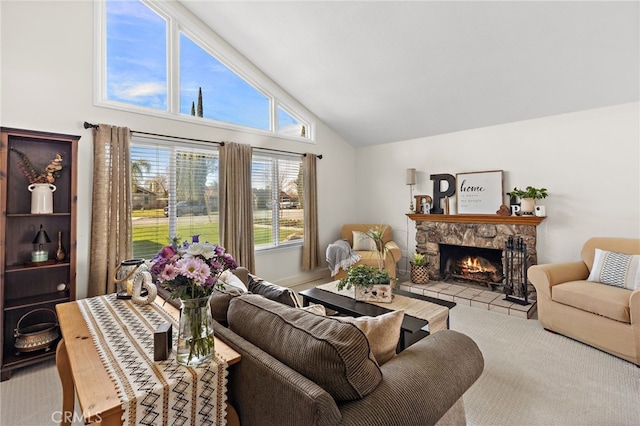 living area featuring high vaulted ceiling and a fireplace