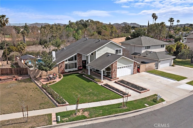 bird's eye view with a residential view and a mountain view