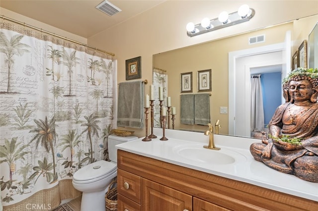 bathroom featuring vanity, toilet, and a shower with shower curtain