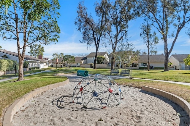 view of community featuring a lawn and a playground