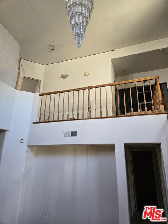 staircase featuring a towering ceiling