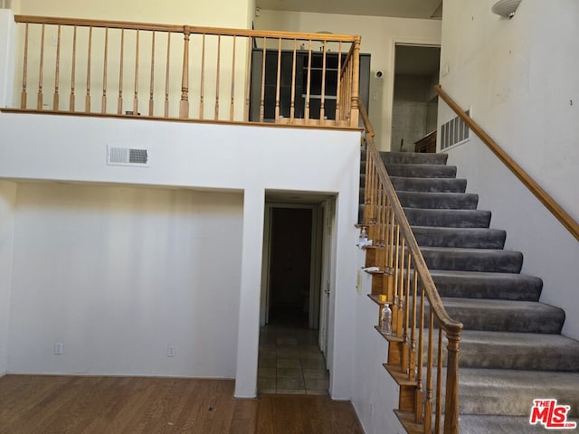 stairs with wood-type flooring