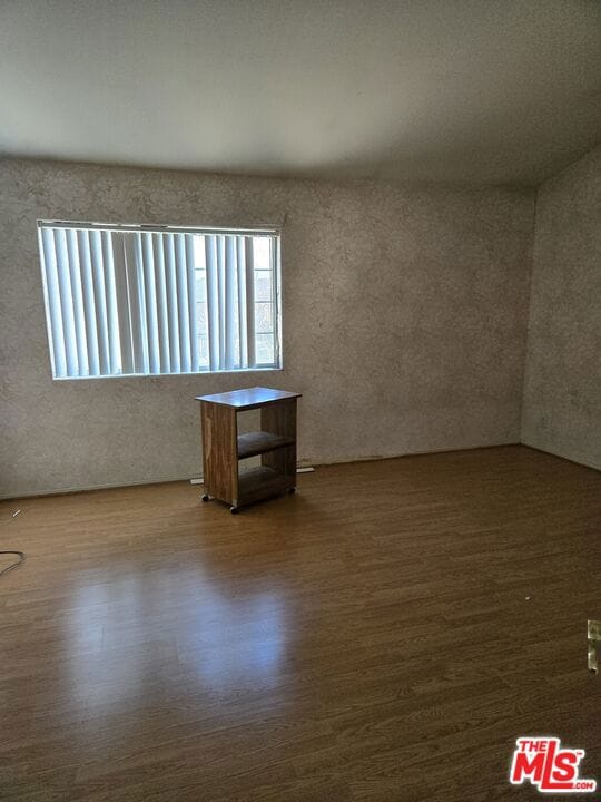 spare room featuring hardwood / wood-style flooring