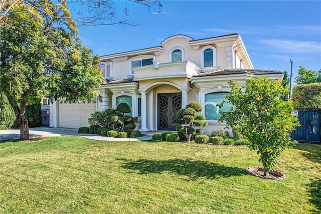 view of front of property featuring a garage and a front lawn