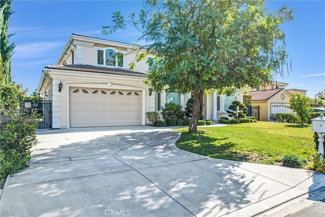 view of front facade with a garage and a front yard