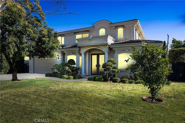 view of front facade with a garage and a front yard