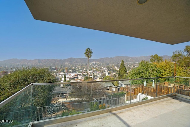 balcony featuring a mountain view