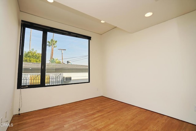 spare room with hardwood / wood-style flooring