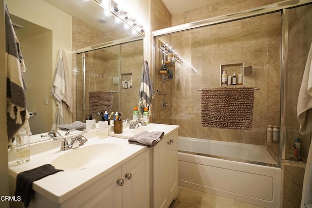 bathroom featuring vanity and combined bath / shower with glass door