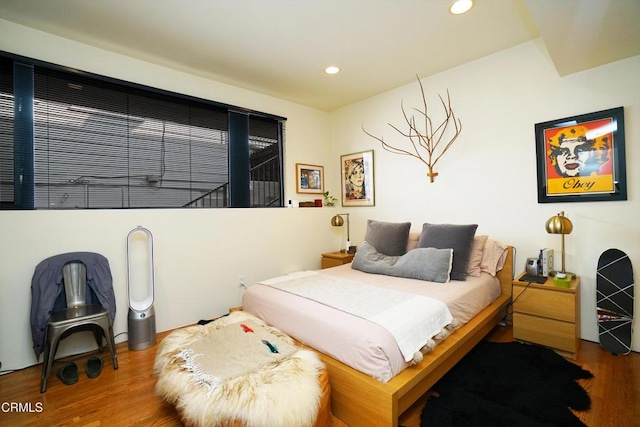 bedroom with hardwood / wood-style floors